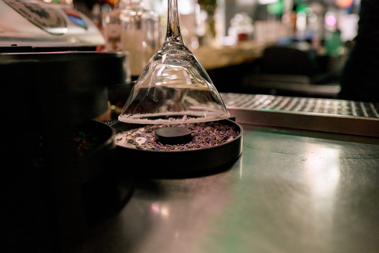 Smoked drink presentation beneath a glass dome at the 1129 bar